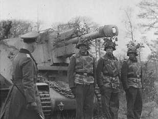 Erwin Rommel inspecting a 10.5cm leFH 18 (Sf.) auf Geschutzwagen 39H(f) self-propelled gun crew
